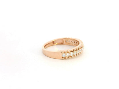 18K rose gold diamond eternity band ring with 0.35 carat round diamonds, minimal stacking wedding band by Emirates Diamonds.