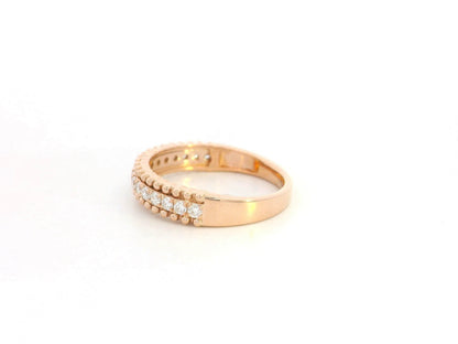 18K rose gold diamond eternity band ring with 0.35 carat round diamonds, minimal stacking wedding band by Emirates Diamonds.