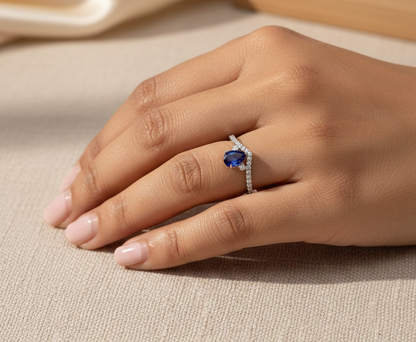 Pear blue sapphire diamond V shape ring in 18K white gold wishbone design Emirates Diamonds