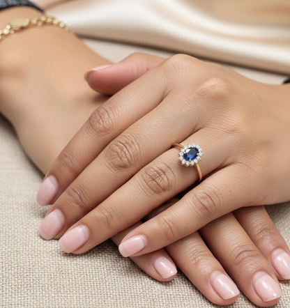 18K yellow gold oval sapphire ring with diamond halo, classic sapphire and diamond ring by Emirates Diamonds