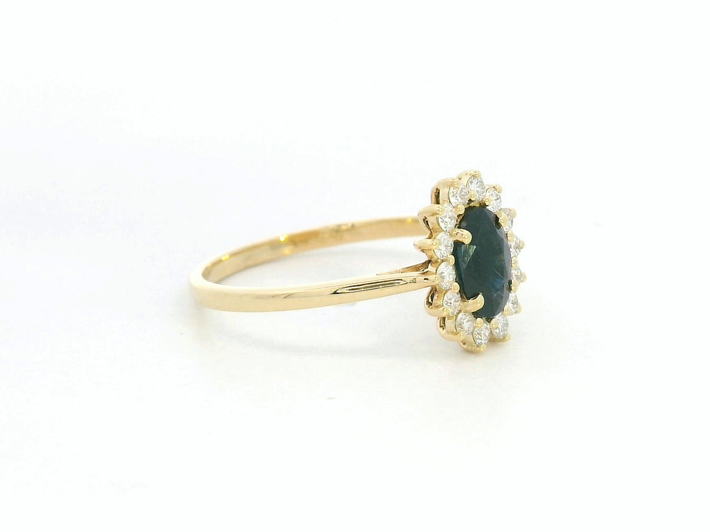 18K yellow gold oval sapphire ring with diamond halo, classic sapphire and diamond ring by Emirates Diamonds