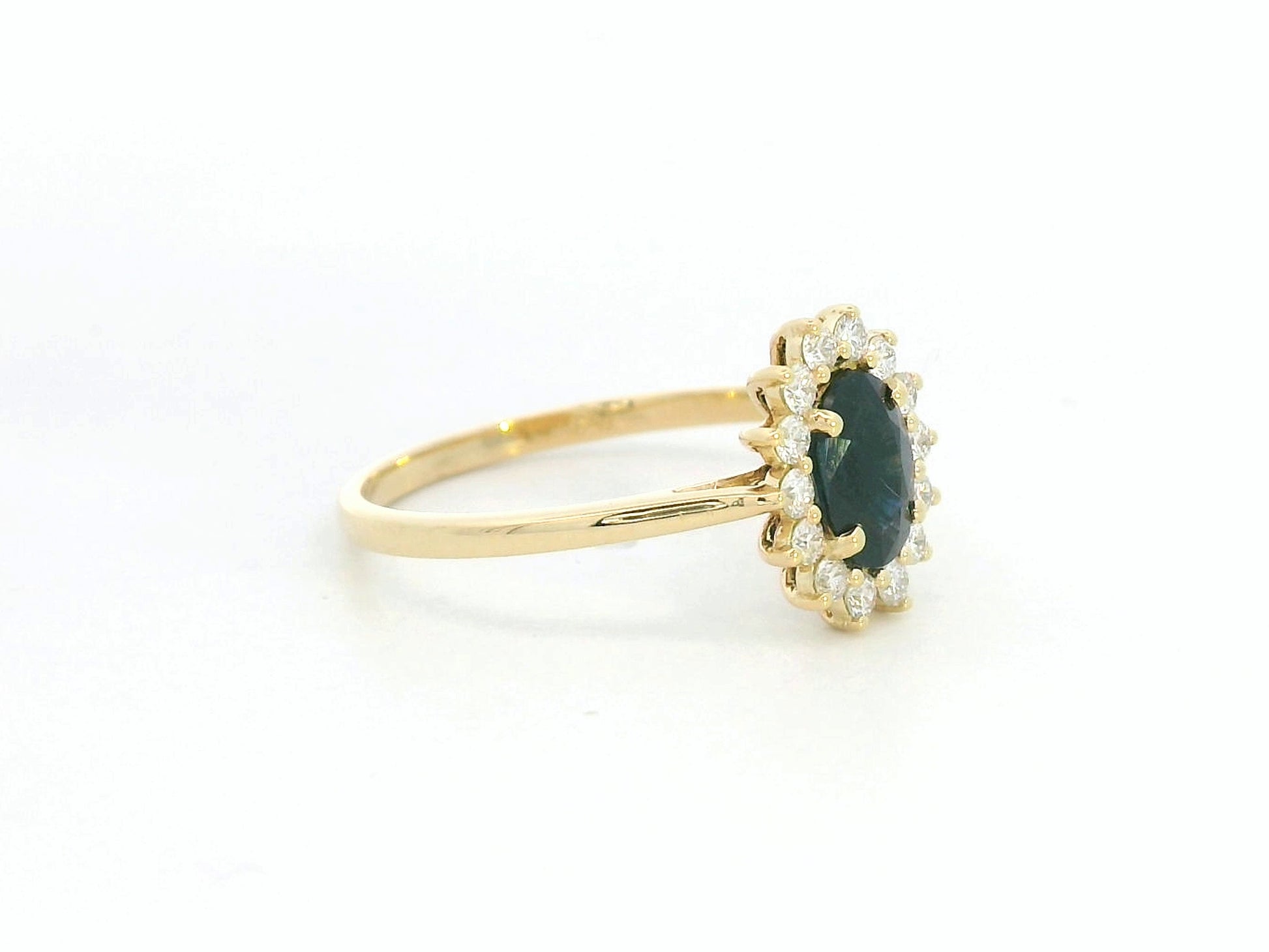 18K yellow gold oval sapphire ring with diamond halo, classic sapphire and diamond ring by Emirates Diamonds