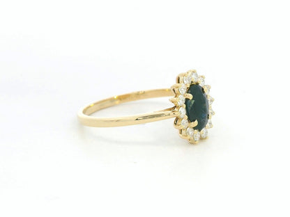 18K yellow gold oval sapphire ring with diamond halo, classic sapphire and diamond ring by Emirates Diamonds