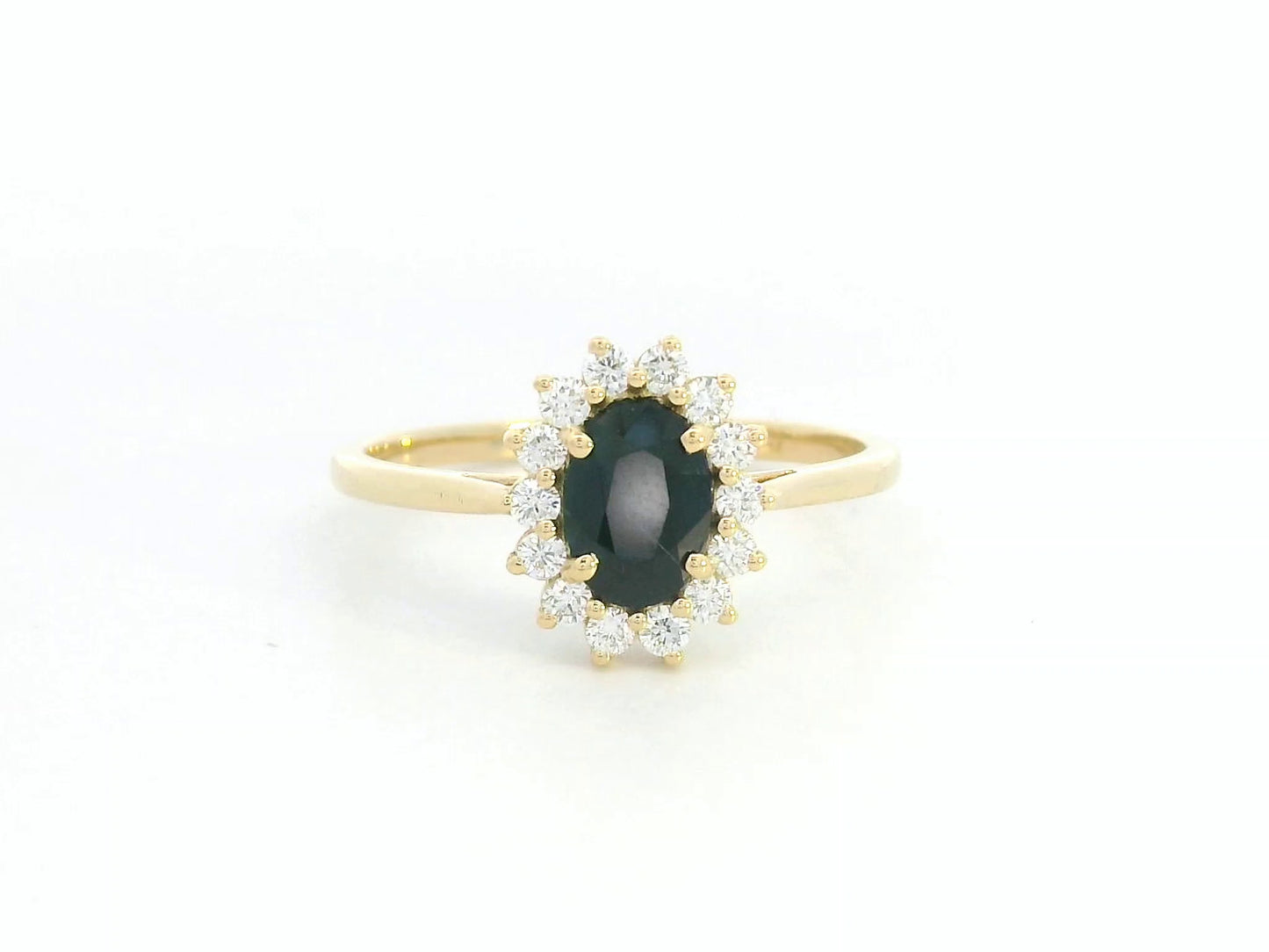 18K yellow gold oval sapphire ring with diamond halo, classic sapphire and diamond ring by Emirates Diamonds