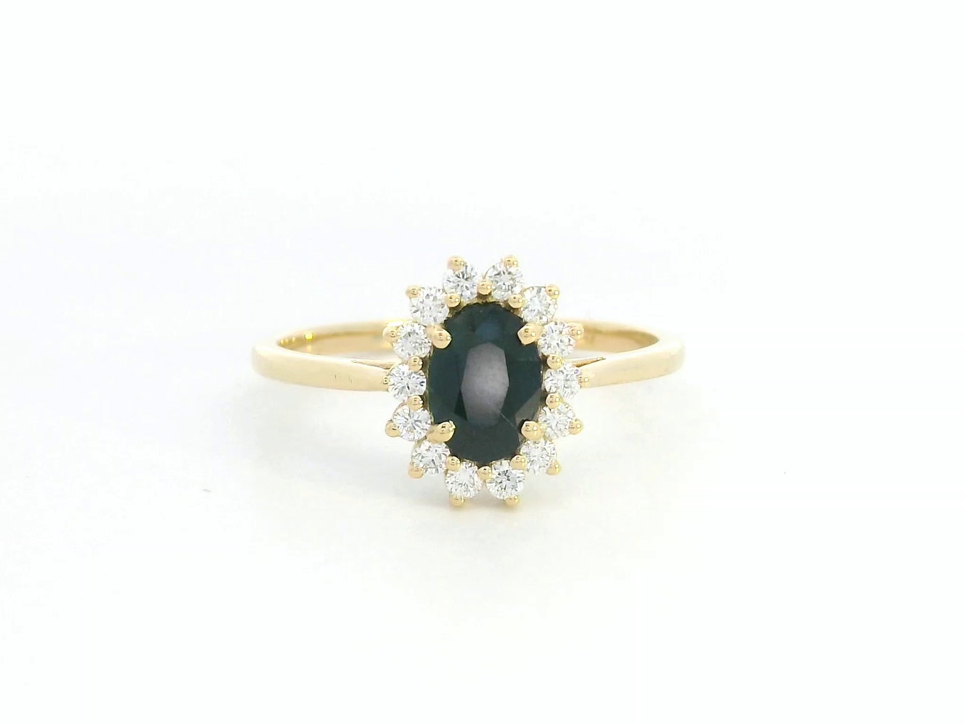 18K yellow gold oval sapphire ring with diamond halo, classic sapphire and diamond ring by Emirates Diamonds