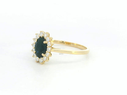 18K yellow gold oval sapphire ring with diamond halo, classic sapphire and diamond ring by Emirates Diamonds