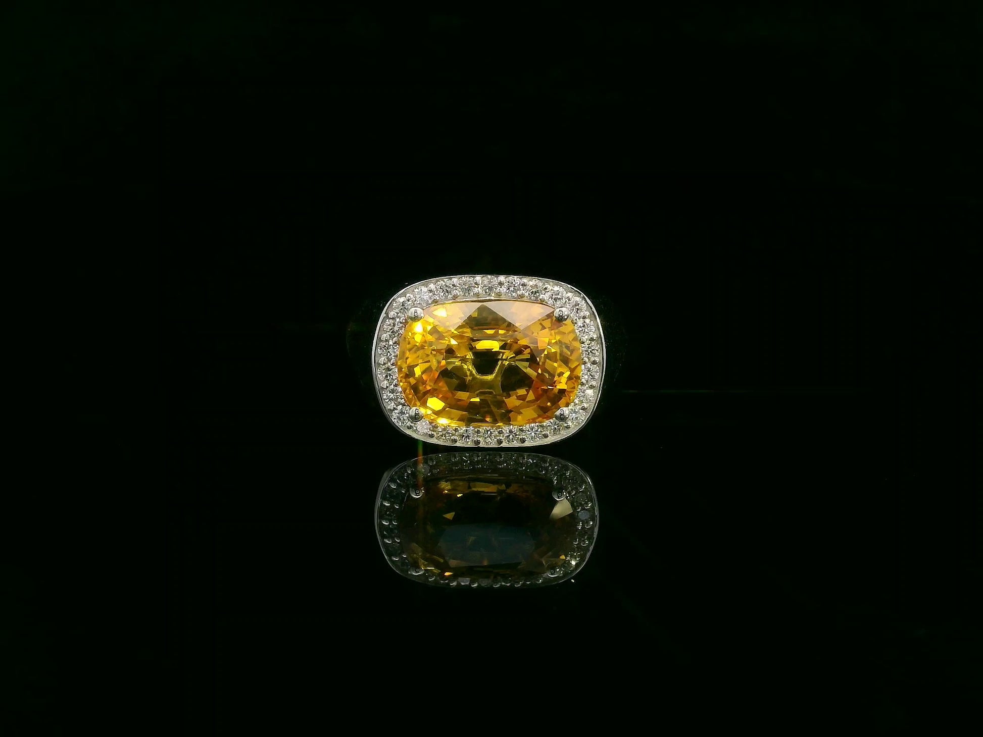 7.50 carat yellow sapphire men’s ring with diamond halo in 18K white gold by Emirates Diamonds Dubai