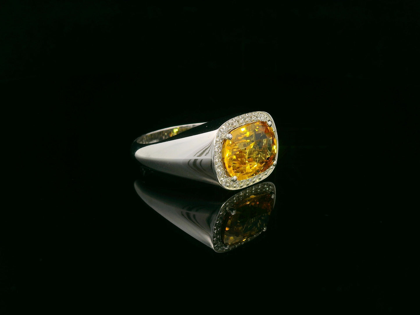 7.50 carat yellow sapphire men’s ring with diamond halo in 18K white gold by Emirates Diamonds Dubai