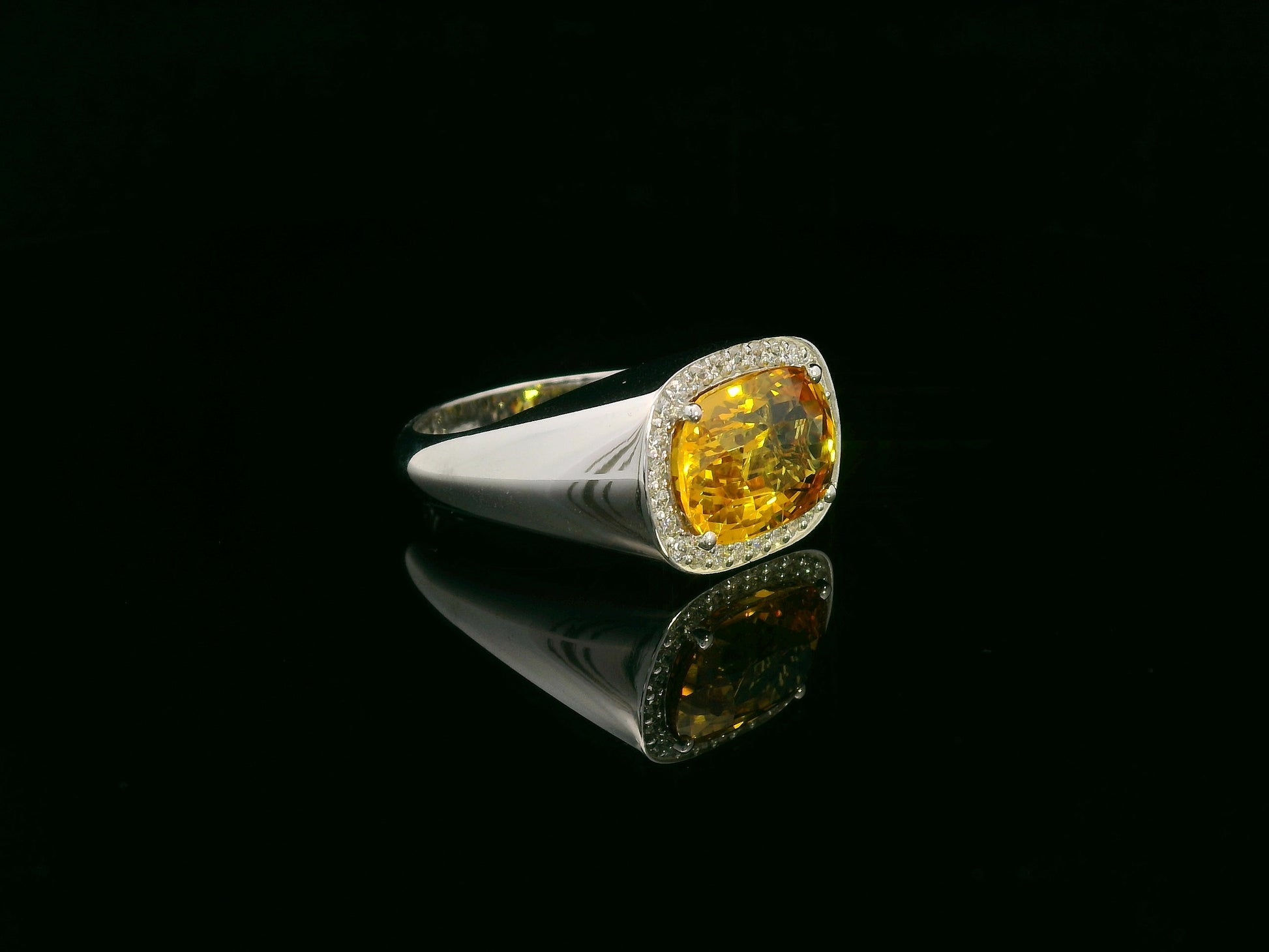 7.50 carat yellow sapphire men’s ring with diamond halo in 18K white gold by Emirates Diamonds Dubai