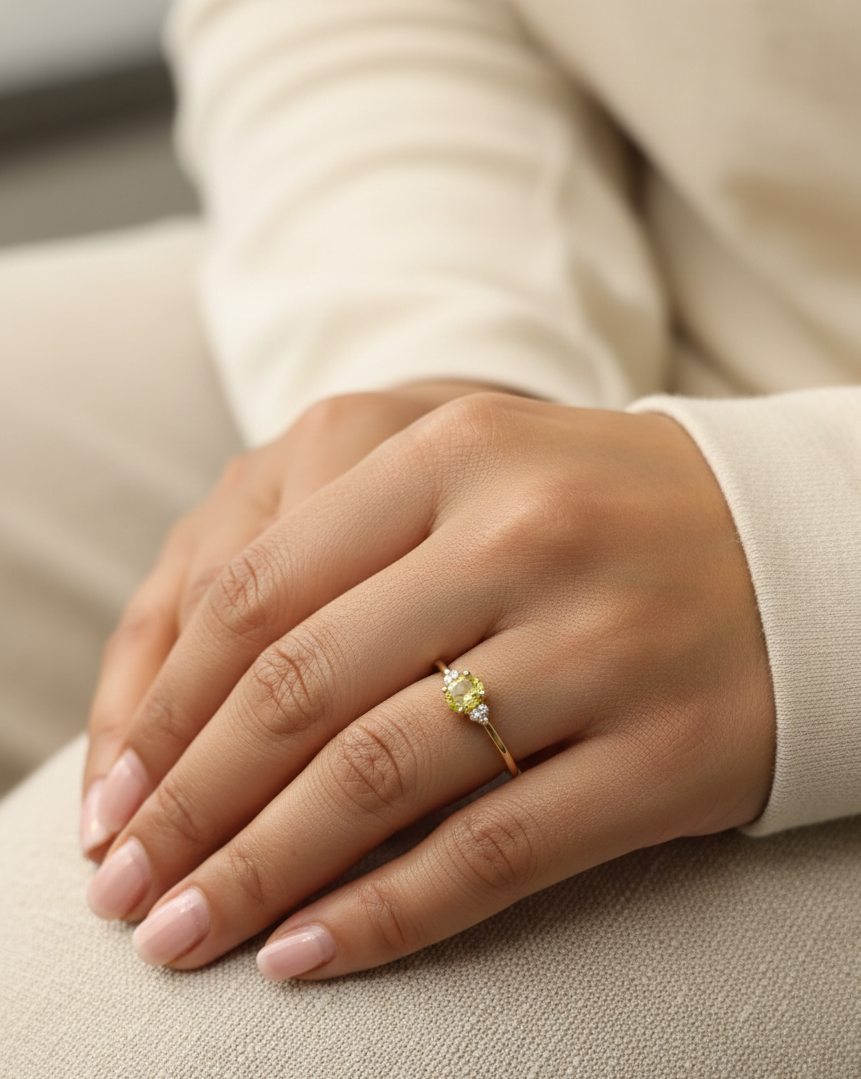 18K yellow gold ring with oval yellow sapphire and diamond accents, elegant gemstone ring by Emirates Diamonds
