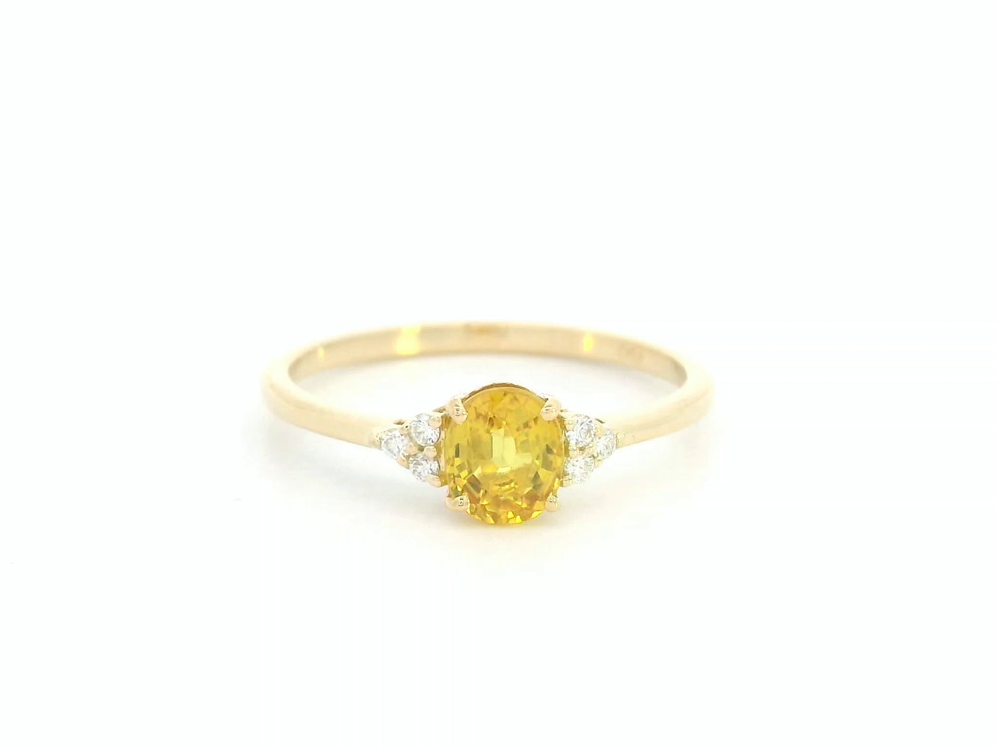 18K yellow gold ring with oval yellow sapphire and diamond accents, elegant gemstone ring by Emirates Diamonds