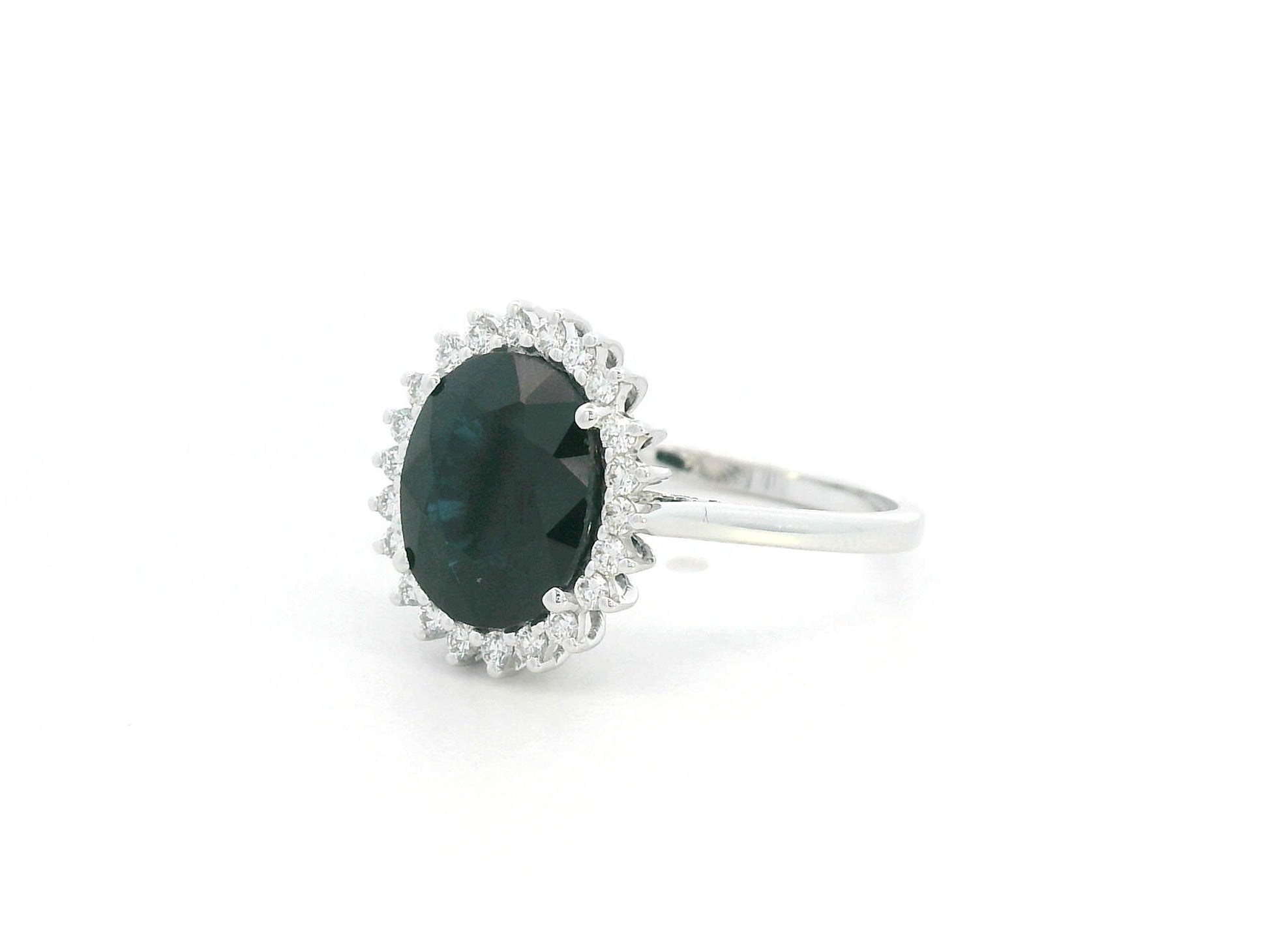 3.41 carat oval blue sapphire and diamond halo ring in 18K white gold by Emirates Diamonds