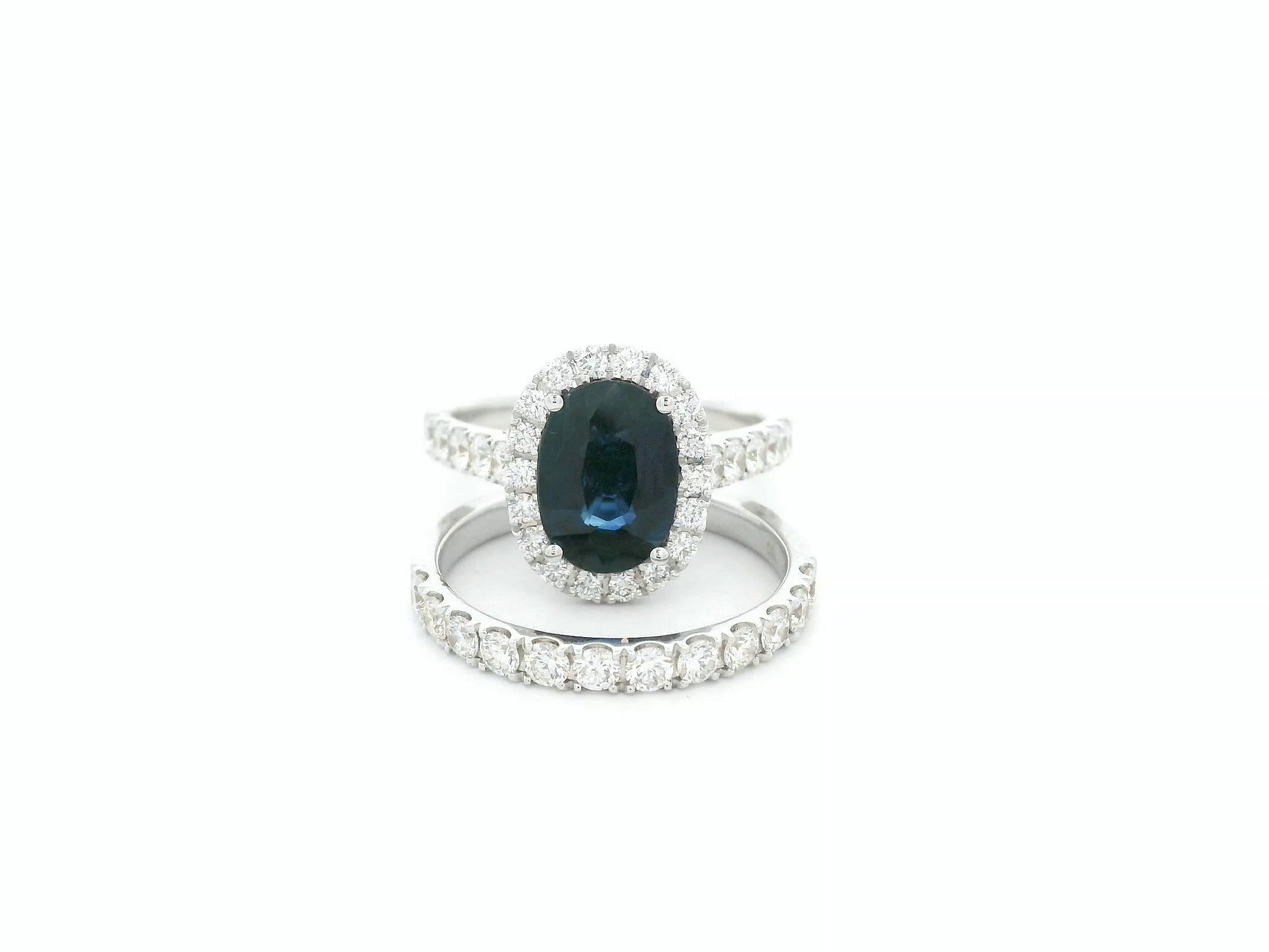 18K white gold blue sapphire and diamond bridal ring set with halo engagement ring and diamond wedding band by Emirates Diamonds