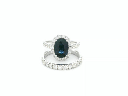 18K white gold blue sapphire and diamond bridal ring set with halo engagement ring and diamond wedding band by Emirates Diamonds