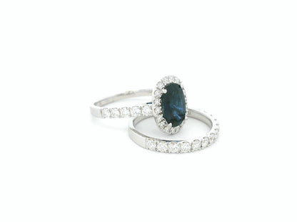 18K white gold blue sapphire and diamond bridal ring set with halo engagement ring and diamond wedding band by Emirates Diamonds