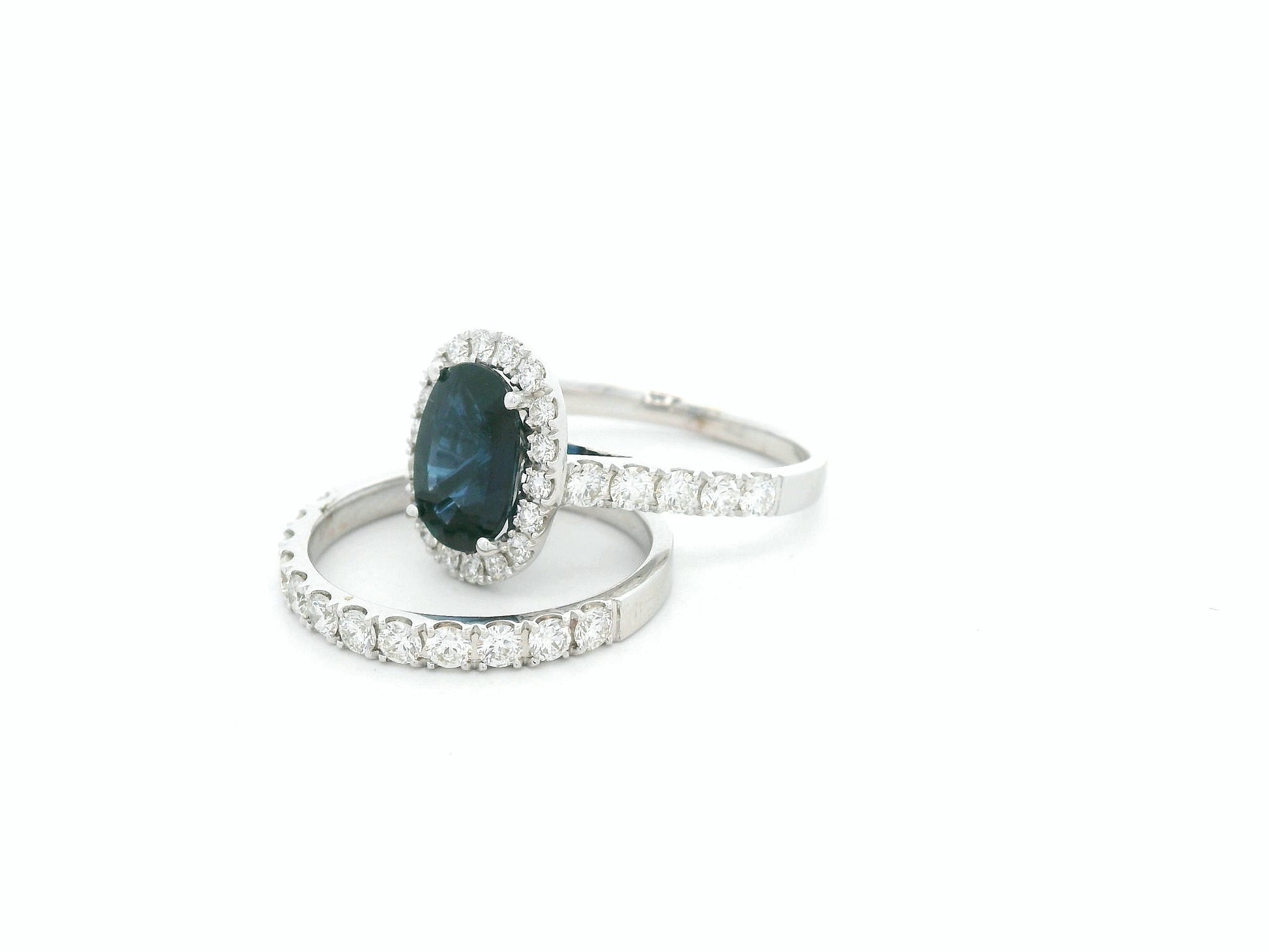 18K white gold blue sapphire and diamond bridal ring set with halo engagement ring and diamond wedding band by Emirates Diamonds