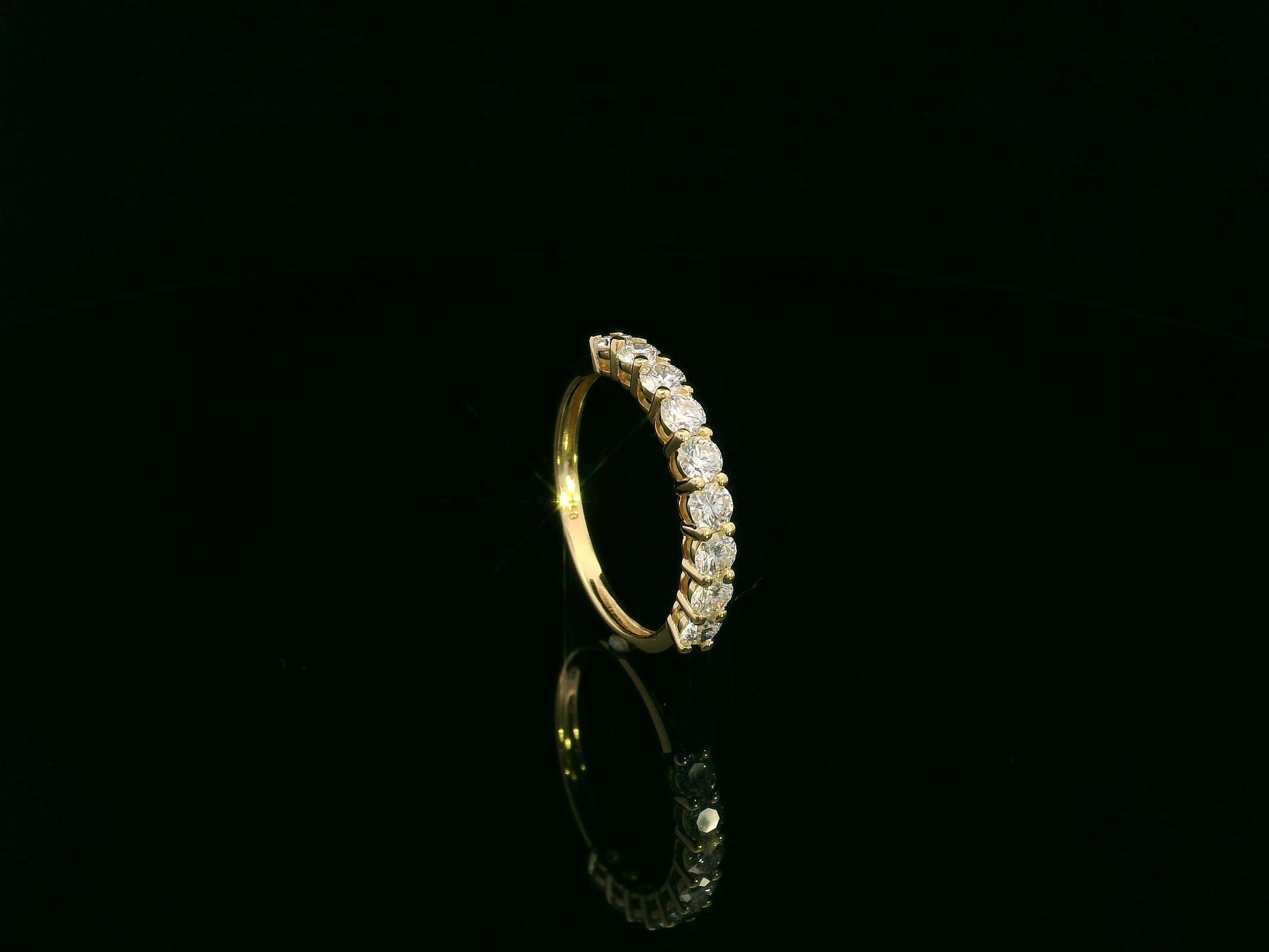 18K yellow gold diamond half eternity ring with round brilliant-cut diamonds by Emirates Diamonds
