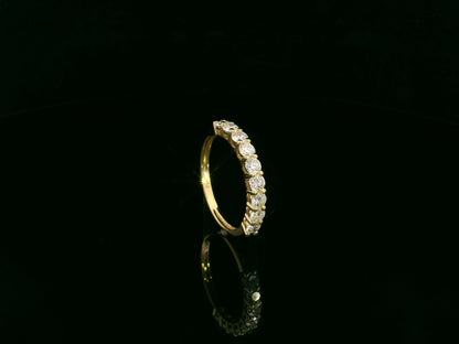 18K yellow gold diamond half eternity ring with round brilliant-cut diamonds by Emirates Diamonds