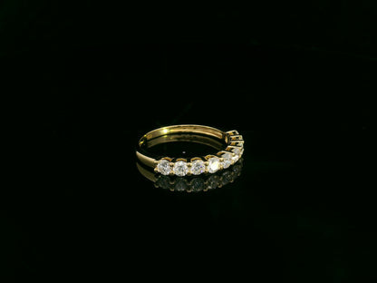 18K yellow gold diamond half eternity ring with round brilliant-cut diamonds by Emirates Diamonds