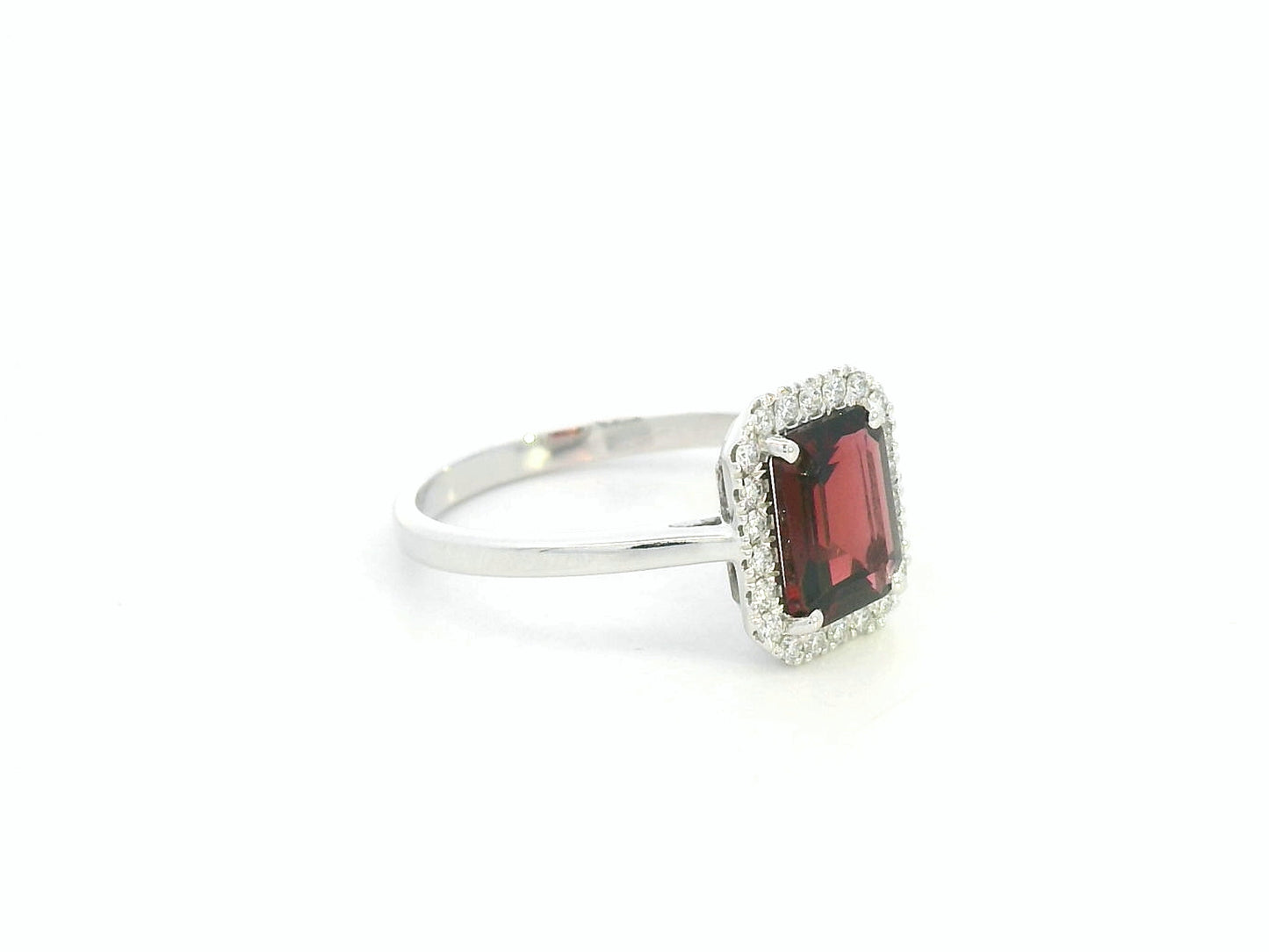 18K white gold emerald-cut garnet ring with diamond halo, elegant gemstone ring by Emirates Diamonds