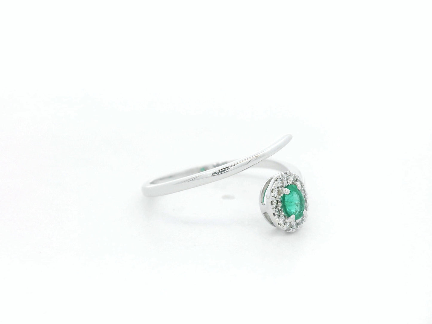 Emerald diamond halo wrap ring in 18K white gold with oval emerald and diamond halo