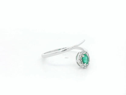 Emerald diamond halo wrap ring in 18K white gold with oval emerald and diamond halo