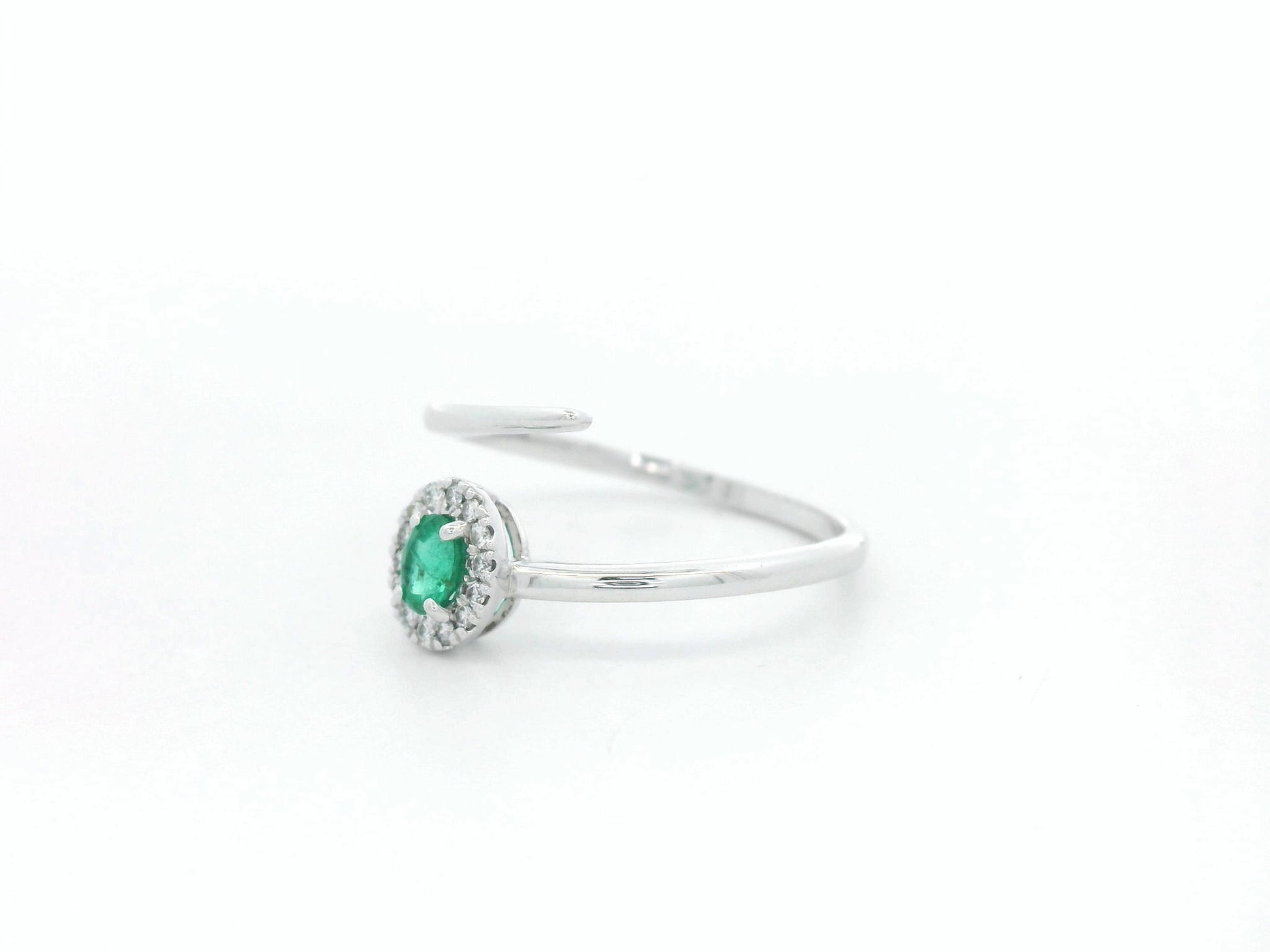 Emerald diamond halo wrap ring in 18K white gold with oval emerald and diamond halo