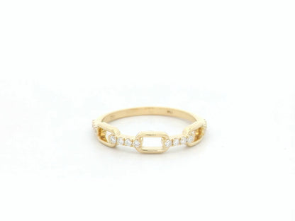 Diamond link band ring in 18K yellow gold with pavé diamond accents by Emirates Diamonds