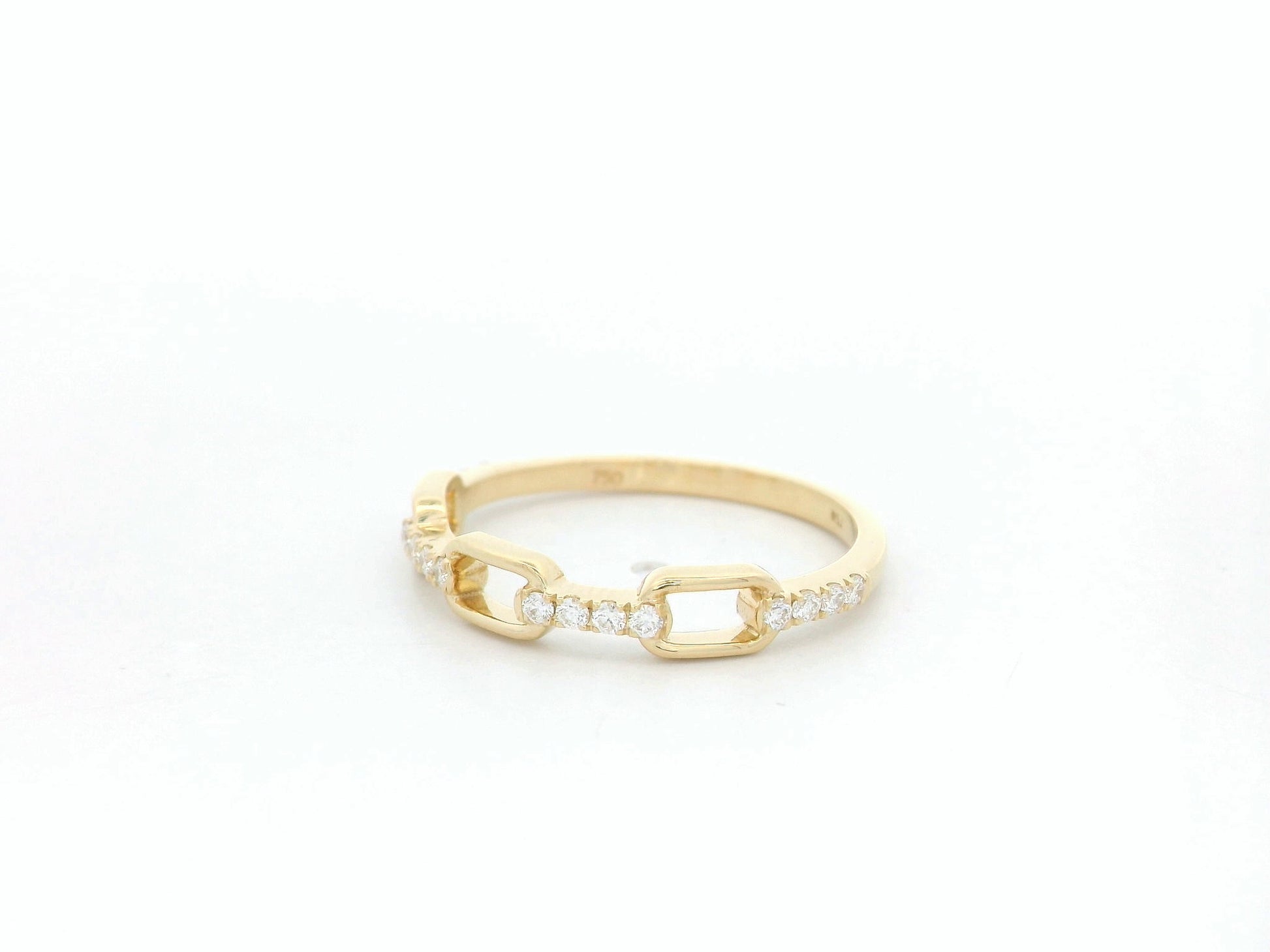 Diamond link band ring in 18K yellow gold with pavé diamond accents by Emirates Diamonds
