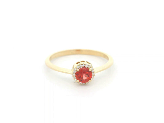 Orange sapphire diamond halo ring in 18K yellow gold by Emirates Diamonds