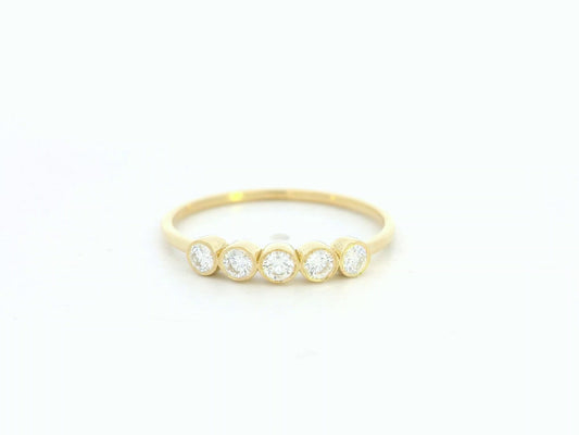18K yellow gold bezel set diamond band ring with five round diamonds
