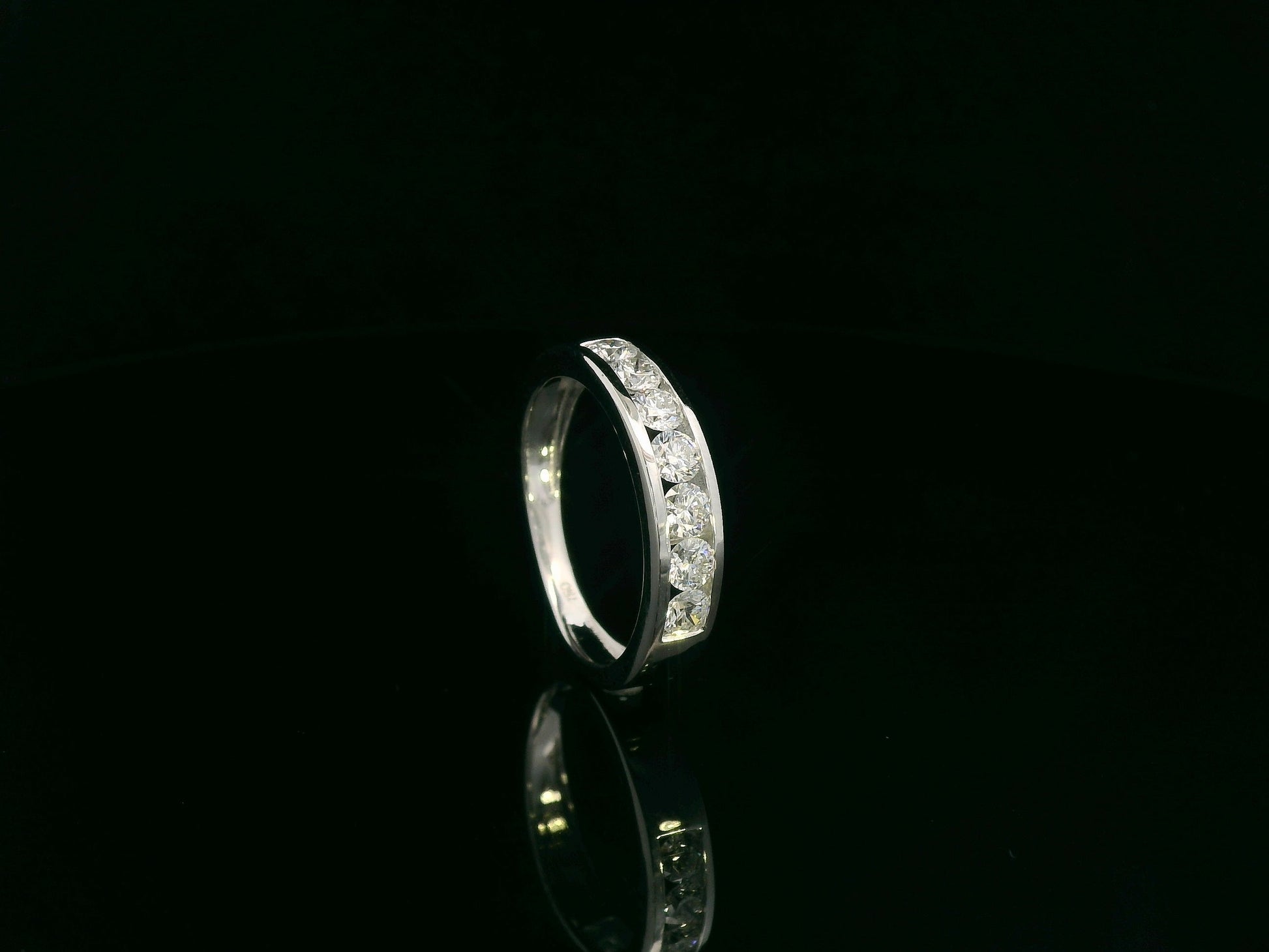 0.92 carat diamond channel set band ring in 18K white gold unisex design by Emirates Diamonds