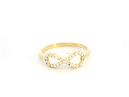 18K yellow gold infinity ring with pavé-set diamonds, total diamond weight 0.21 carat, Emirates Diamonds.