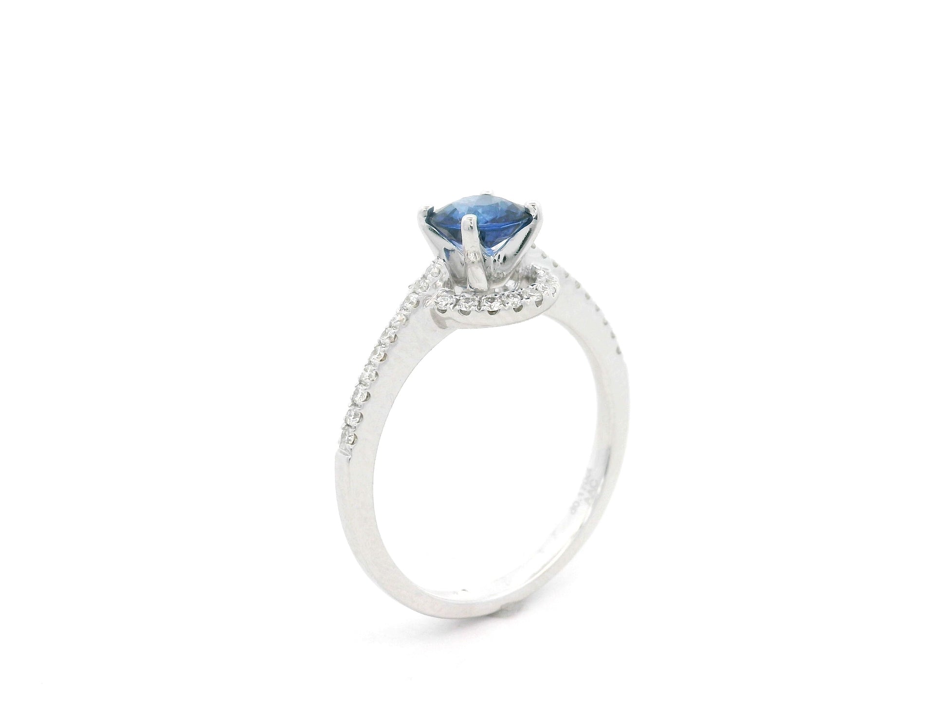 0.67 carat blue sapphire and diamond halo ring in 18K white gold by Emirates Diamonds