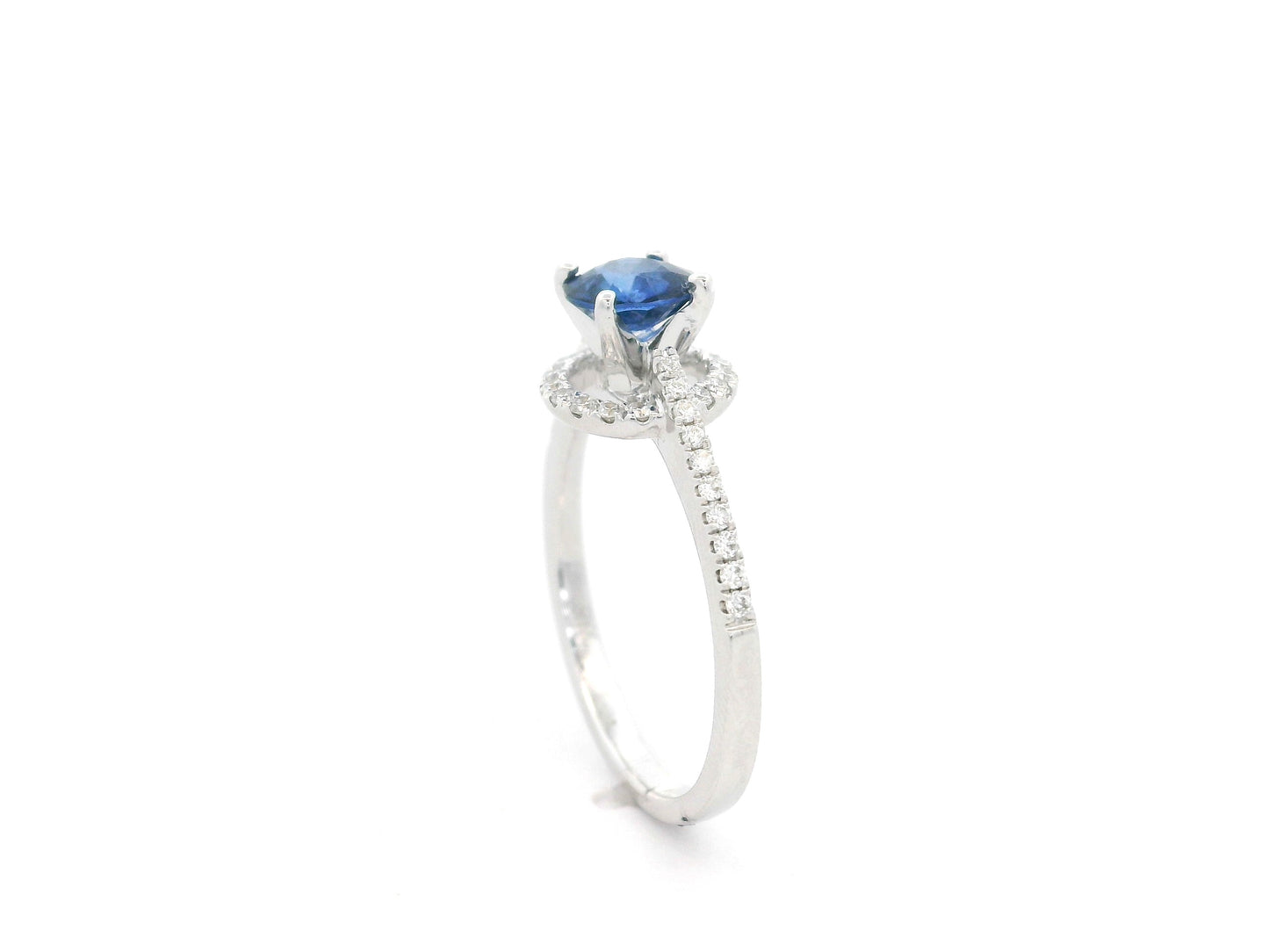 0.67 carat blue sapphire and diamond halo ring in 18K white gold by Emirates Diamonds