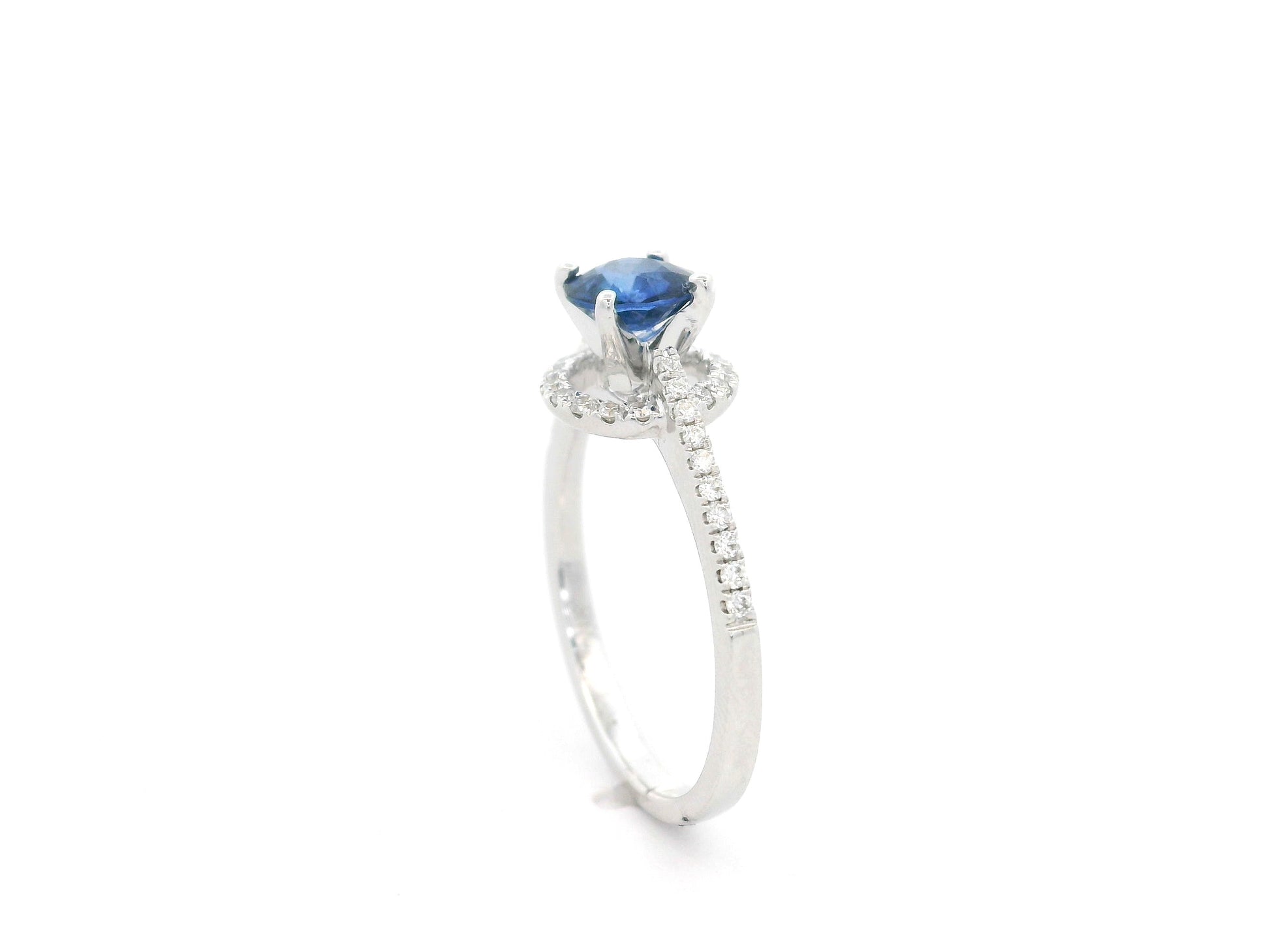 0.67 carat blue sapphire and diamond halo ring in 18K white gold by Emirates Diamonds
