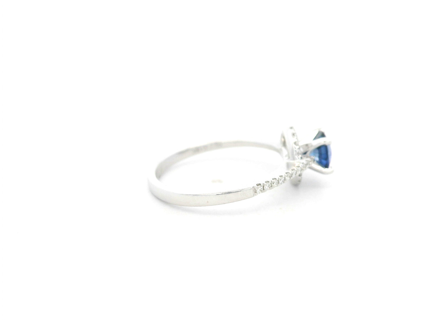 0.67 carat blue sapphire and diamond halo ring in 18K white gold by Emirates Diamonds