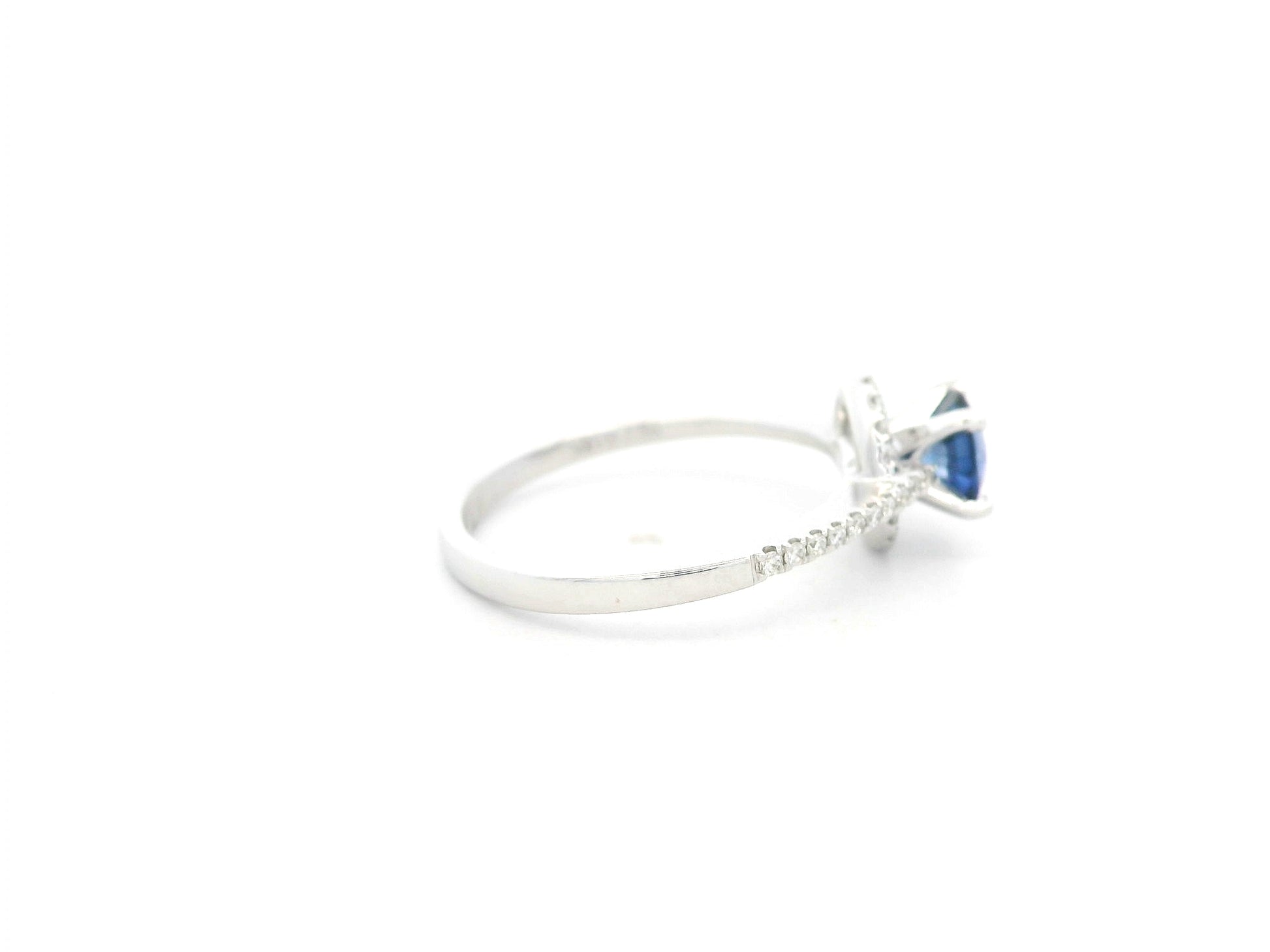 0.67 carat blue sapphire and diamond halo ring in 18K white gold by Emirates Diamonds