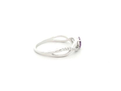 Heart-shaped pink sapphire and diamond ring in 18K white gold with curved band design – Emirates Diamonds