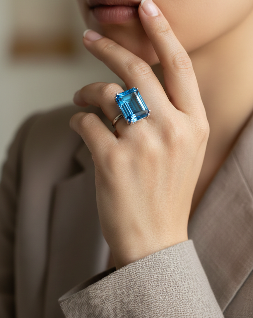 27.63 carat Swiss Blue Topaz emerald cut ring in 18K white gold by Emirates Diamonds