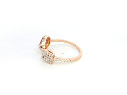 Ruby and diamond open ring in 18K rose gold with pear-shaped ruby and pavé diamond accent – Emirates Diamonds