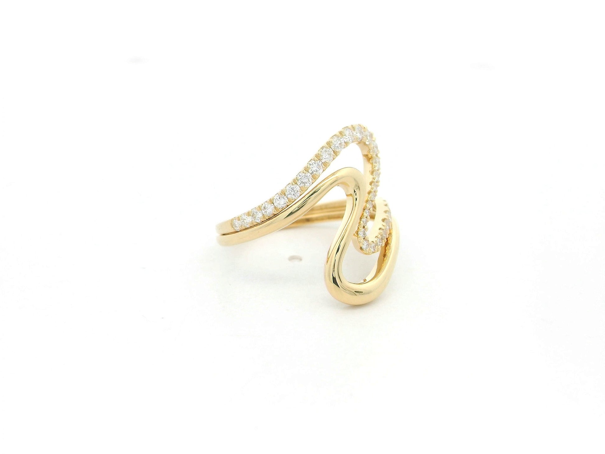 Diamond statement ring with sculptural design in 18K yellow gold by Emirates Diamonds