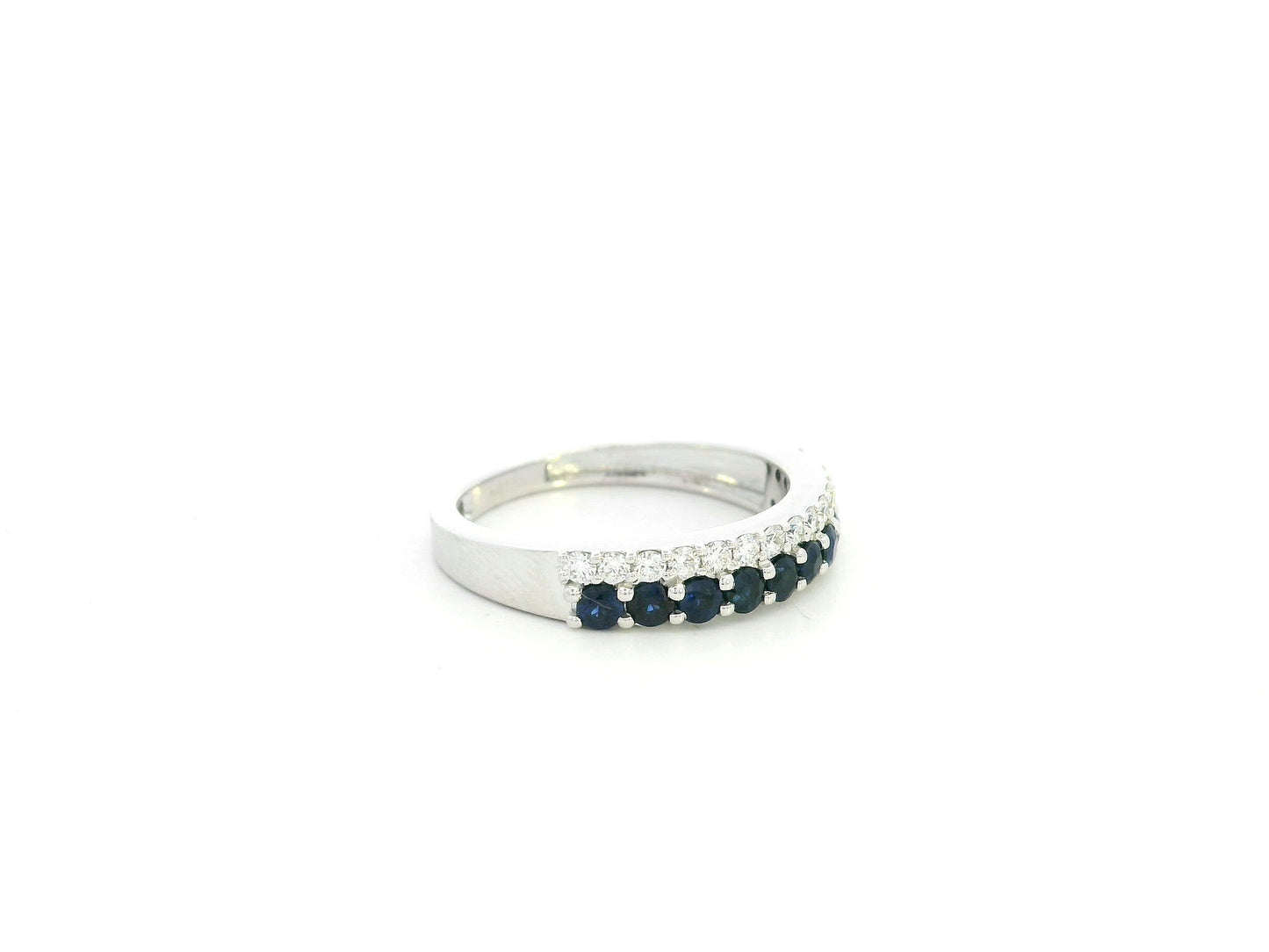 Blue sapphire and diamond band ring in 18K white gold featuring 0.62 carats of sapphires and 0.25 carats of diamonds by Emirates Diamonds.