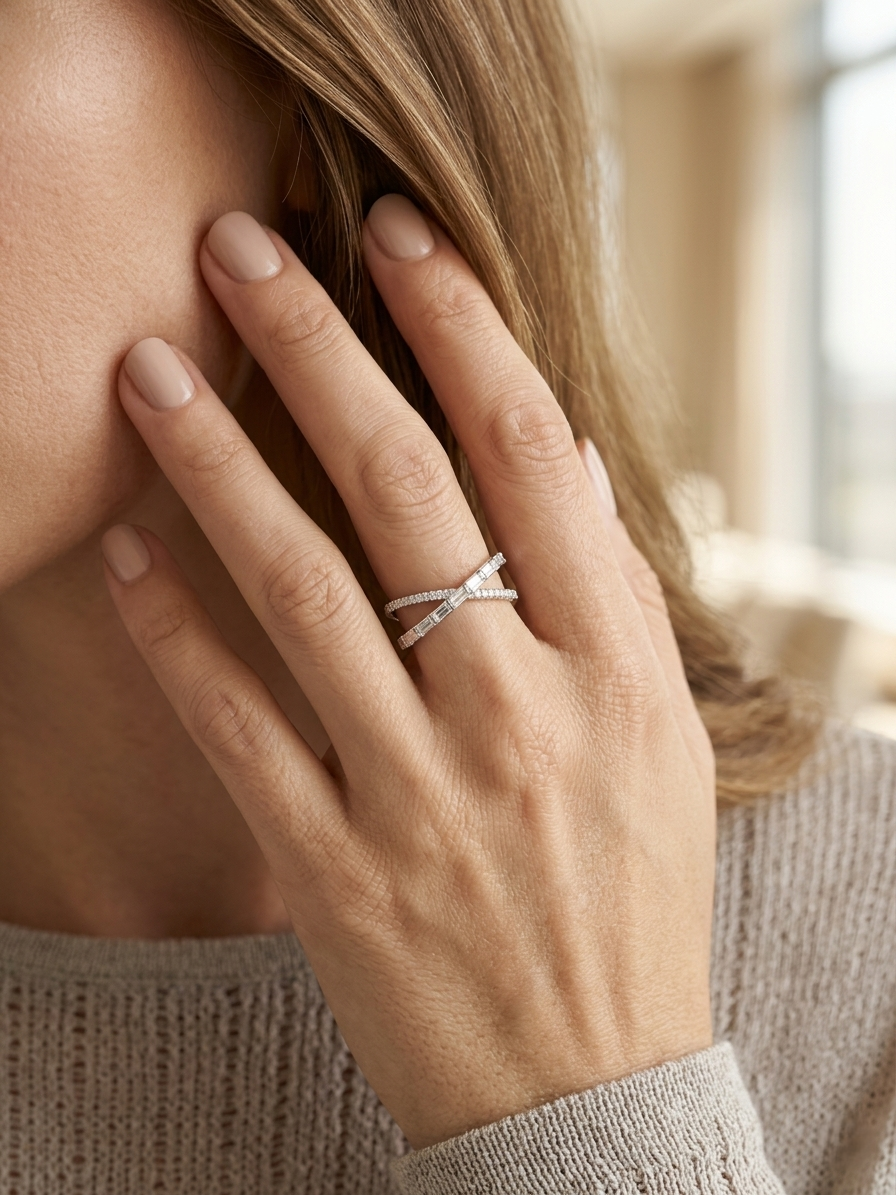 Baguette and round diamond crossover ring in 18K white gold criss-cross design Emirates Diamonds