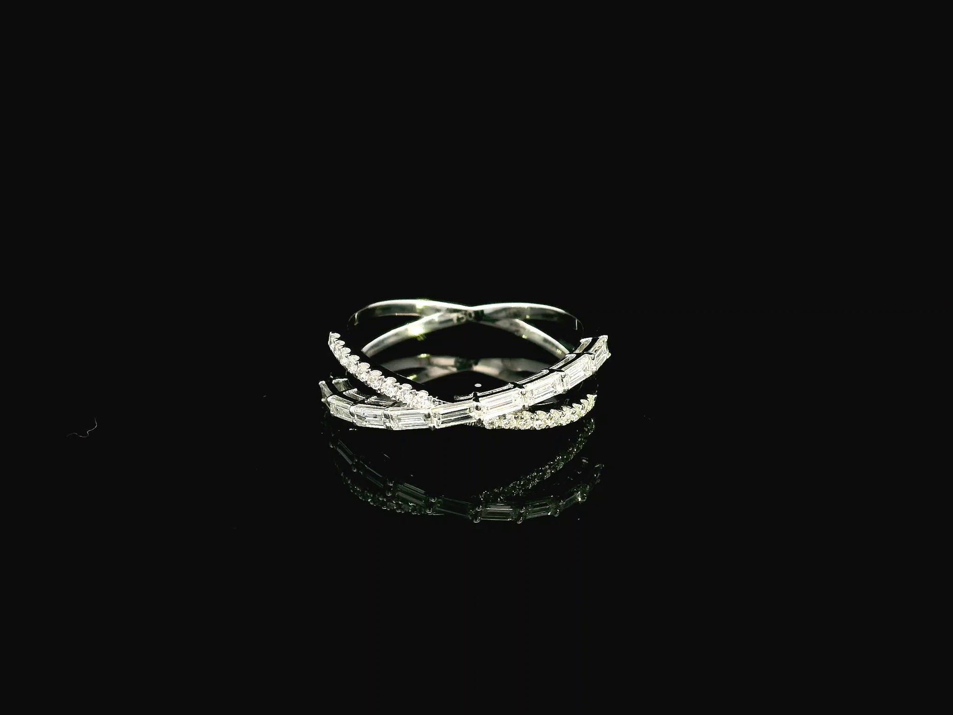 Baguette and round diamond crossover ring in 18K white gold criss-cross design Emirates Diamonds