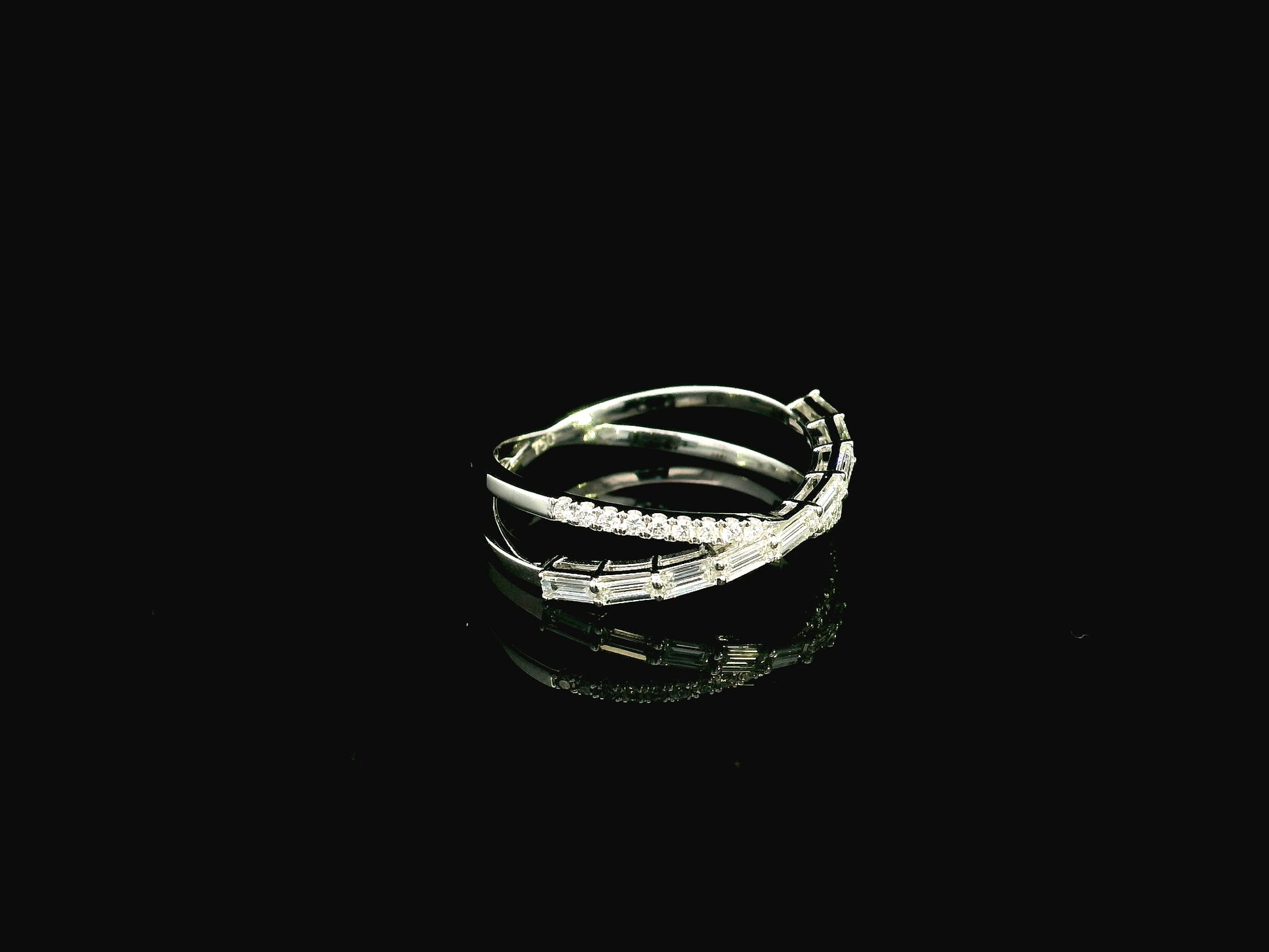Baguette and round diamond crossover ring in 18K white gold criss-cross design Emirates Diamonds