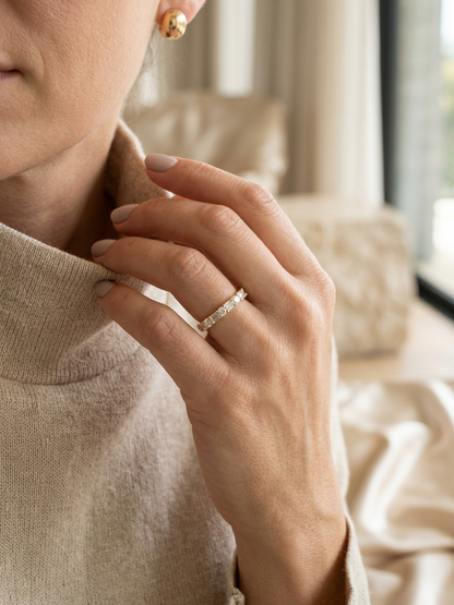 Round and baguette diamond band ring in 18K yellow gold by Emirates Diamonds