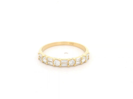 Round and baguette diamond band ring in 18K yellow gold by Emirates Diamonds