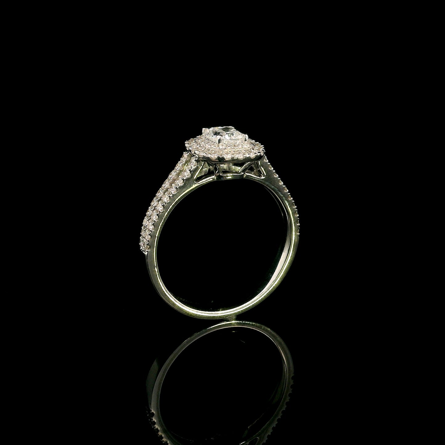 18K white gold halo engagement ring featuring a 0.51 carat GIA certified natural cushion cut diamond with D colour and VS2 clarity, surrounded by a double halo and split shank set with 0.50 carat natural round brilliant diamonds.