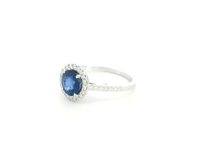 Blue sapphire halo ring with diamonds in 18K white gold by Emirates Diamonds